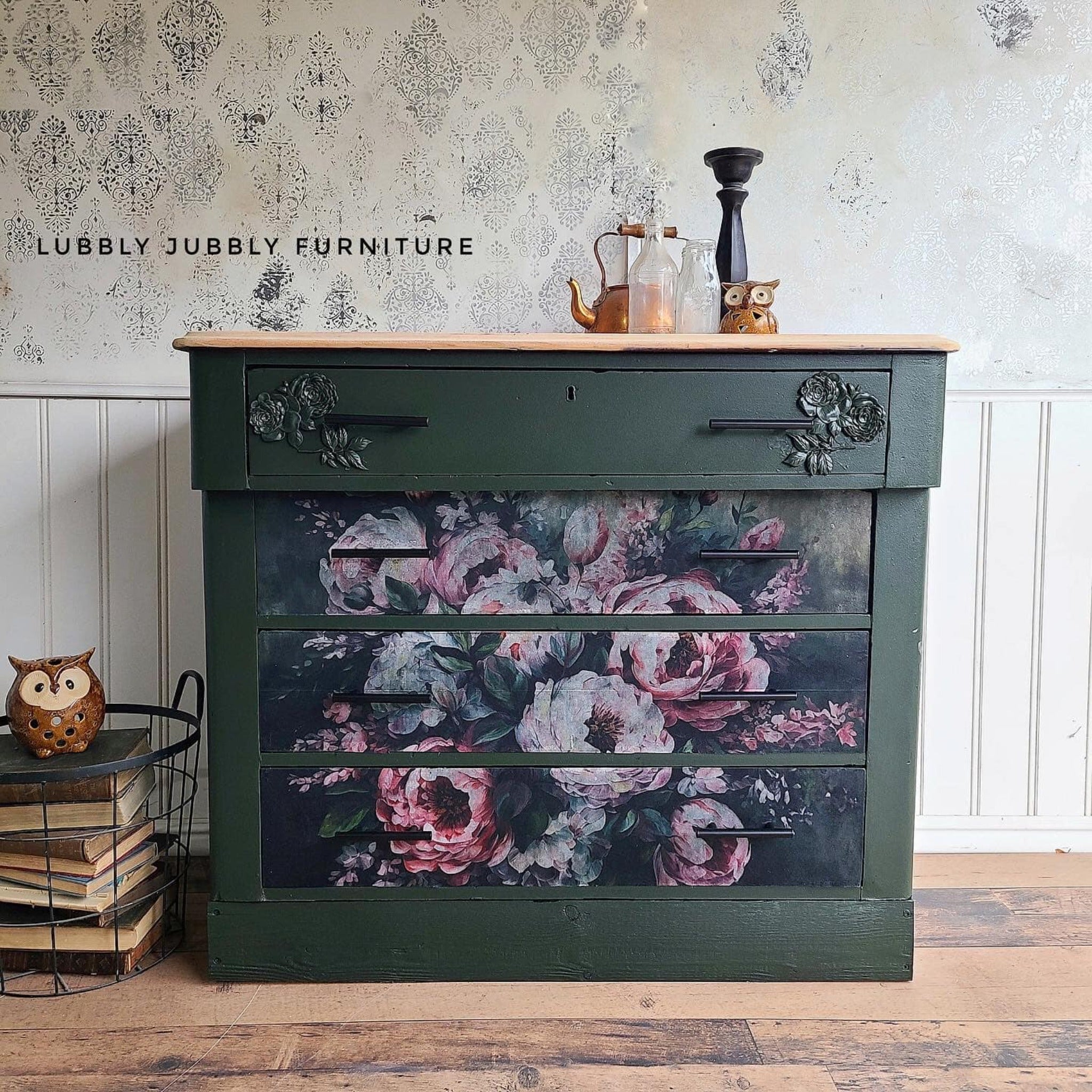 A vintage 4-drawer dresser refurbished by Lubby Jubbly Furniture is painted a dark pine green and features ReDesign with Prima's Mossy Rose Delight A1 fiber paper on its bottom 3 drawers.