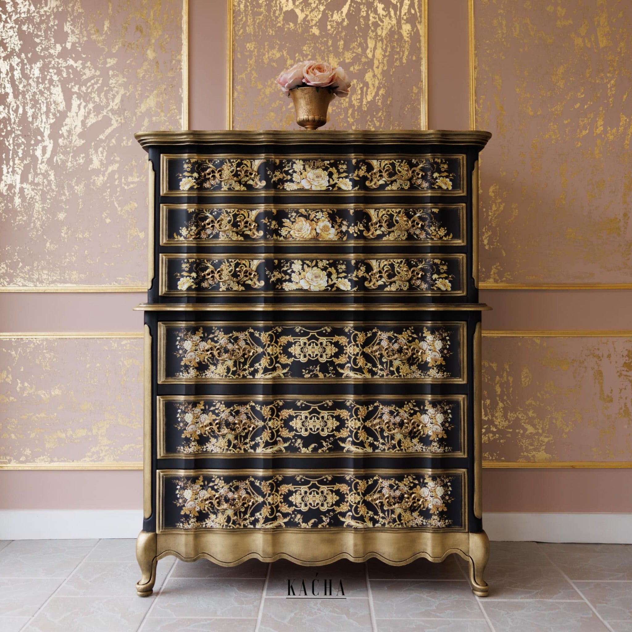 A vintage chest dresser refurbished by Kacha is painted black with gold accents and features ReDesign with Prima's Kacha Orleans transfer on the drawers.