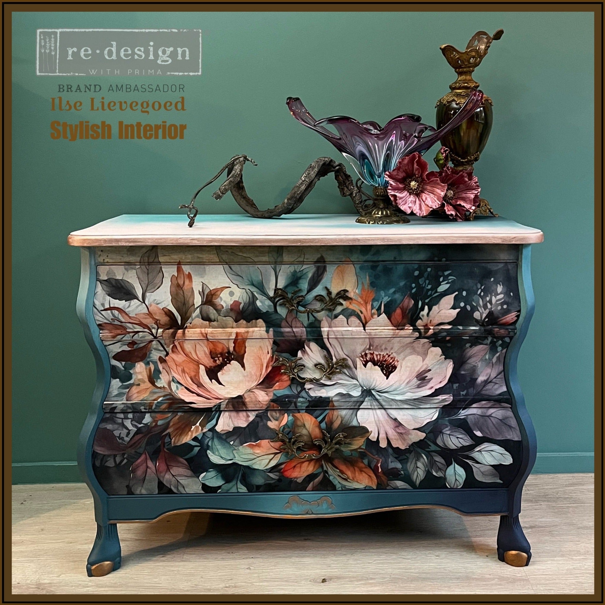 A vintage dresser refurbished by Ilse Lievegoed Stylish Interior is painted dark teal blue with natural light wood accents and features ReDesign with Prima's Floral Dream A1 fiber paper on its 3 drawers.