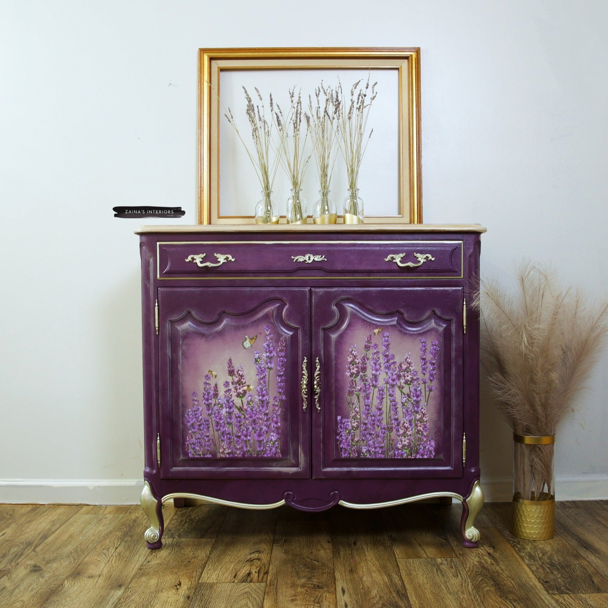 A French Provencial small buffet table refurbished by Zaina's Interiors is painted eggplant purple and features ReDesign with Prima's Champs de Lavende transfer on its 2 door inlays.