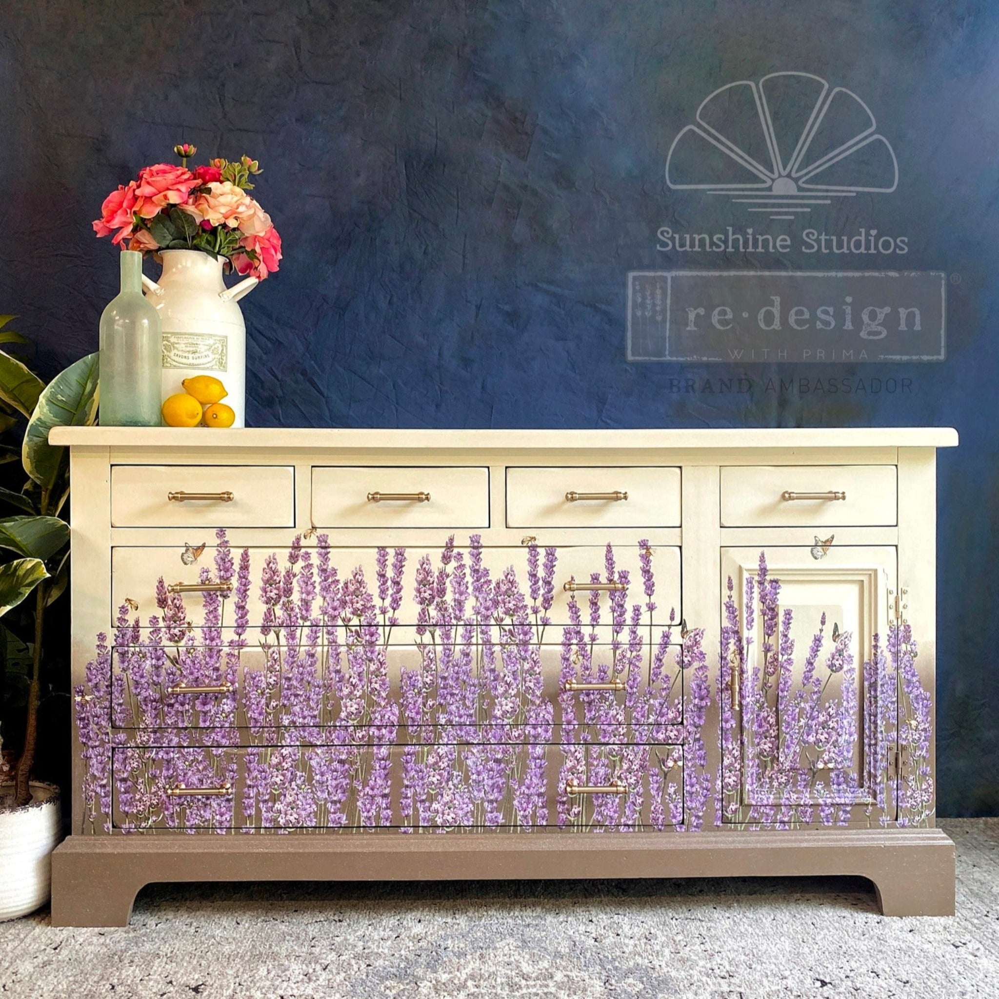 A large vintage dresser refurbished by Sunshine Studios is painted an ombre of pale yellow down to a light brown and features ReDesign with Prima's Champs de Lavende transfer on it.