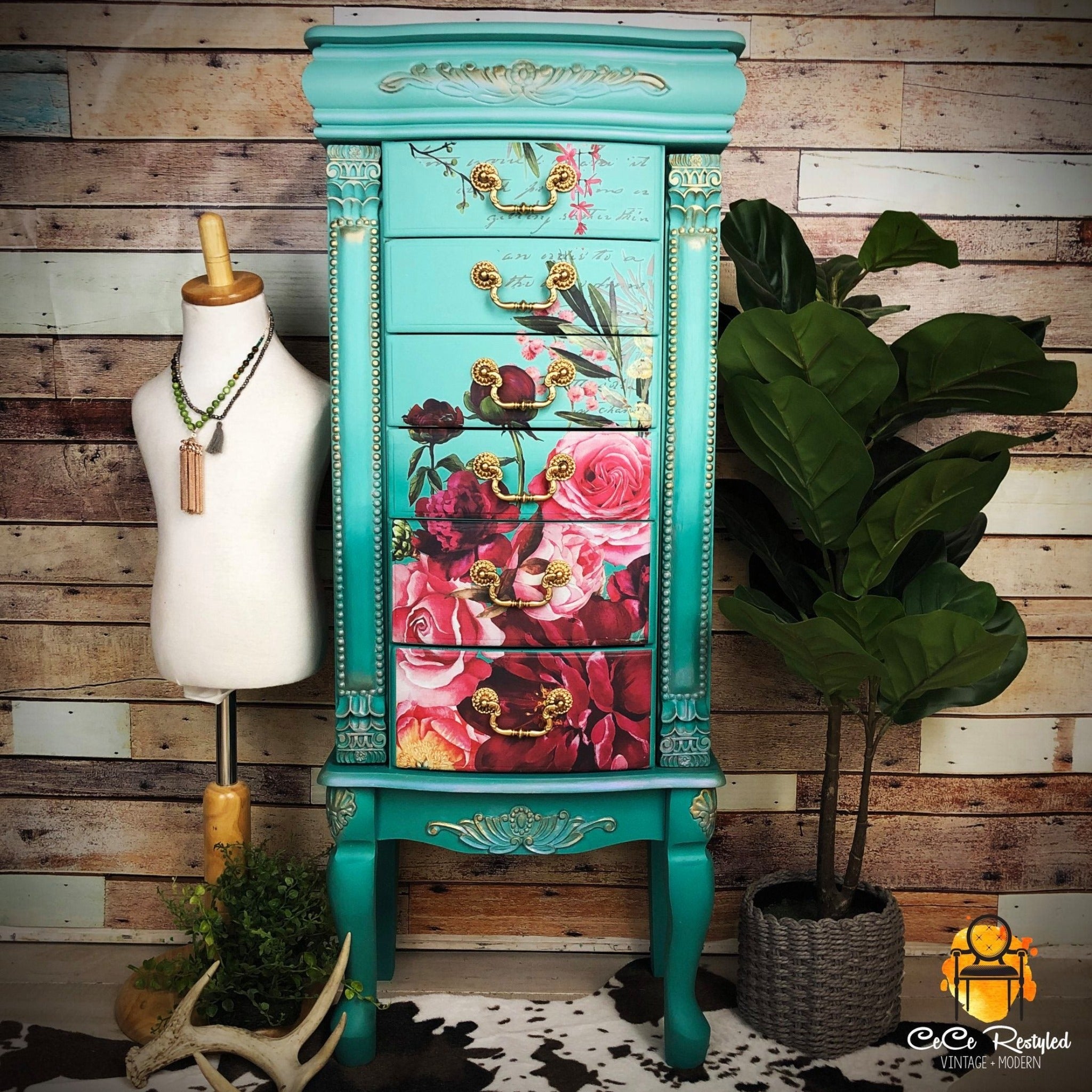 A vintage standing jewelry armoire refurbished by CeCe ReStyled is painted an ombre of light teal down to dark teal with gold accents and features ReDesign with Prima's Royal Burgundy transfer on its front drawers.