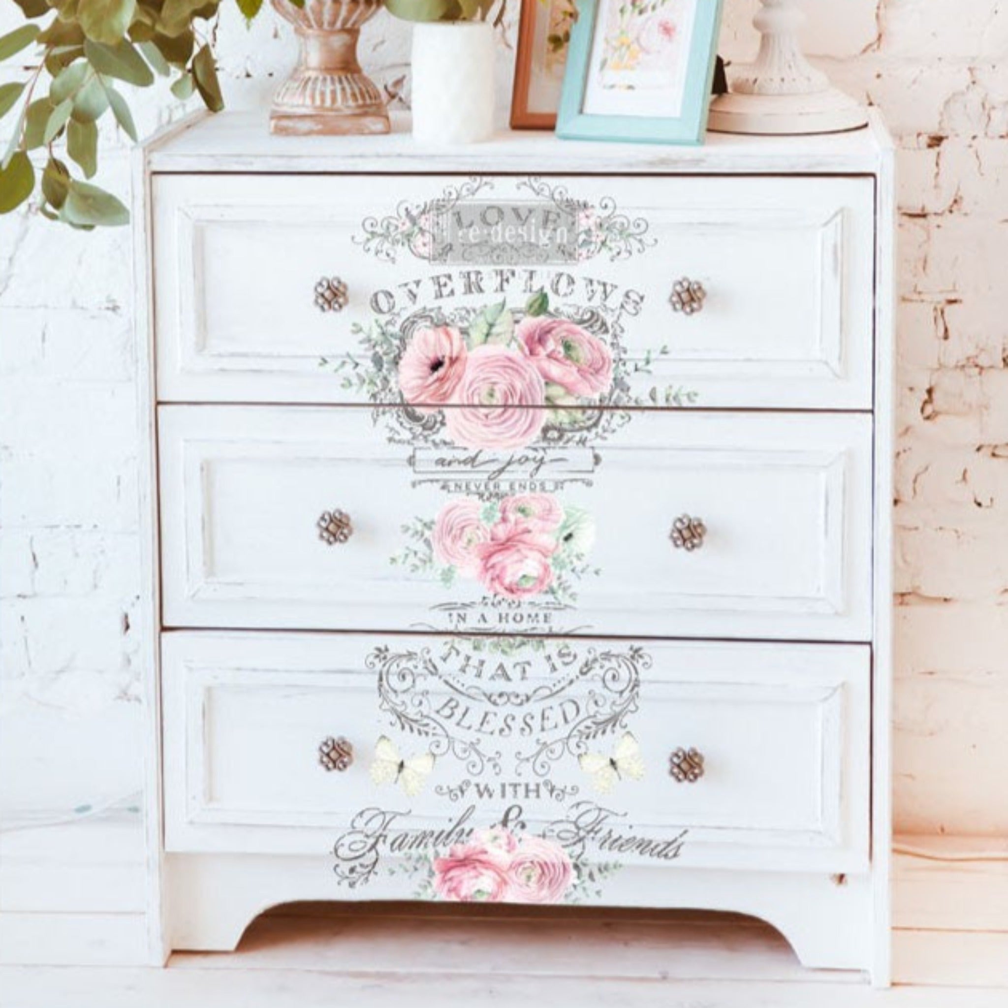 A white 3-drawer nightstand features ReDesign with Prima's Overflowing Love transfer down the center of the drawers.