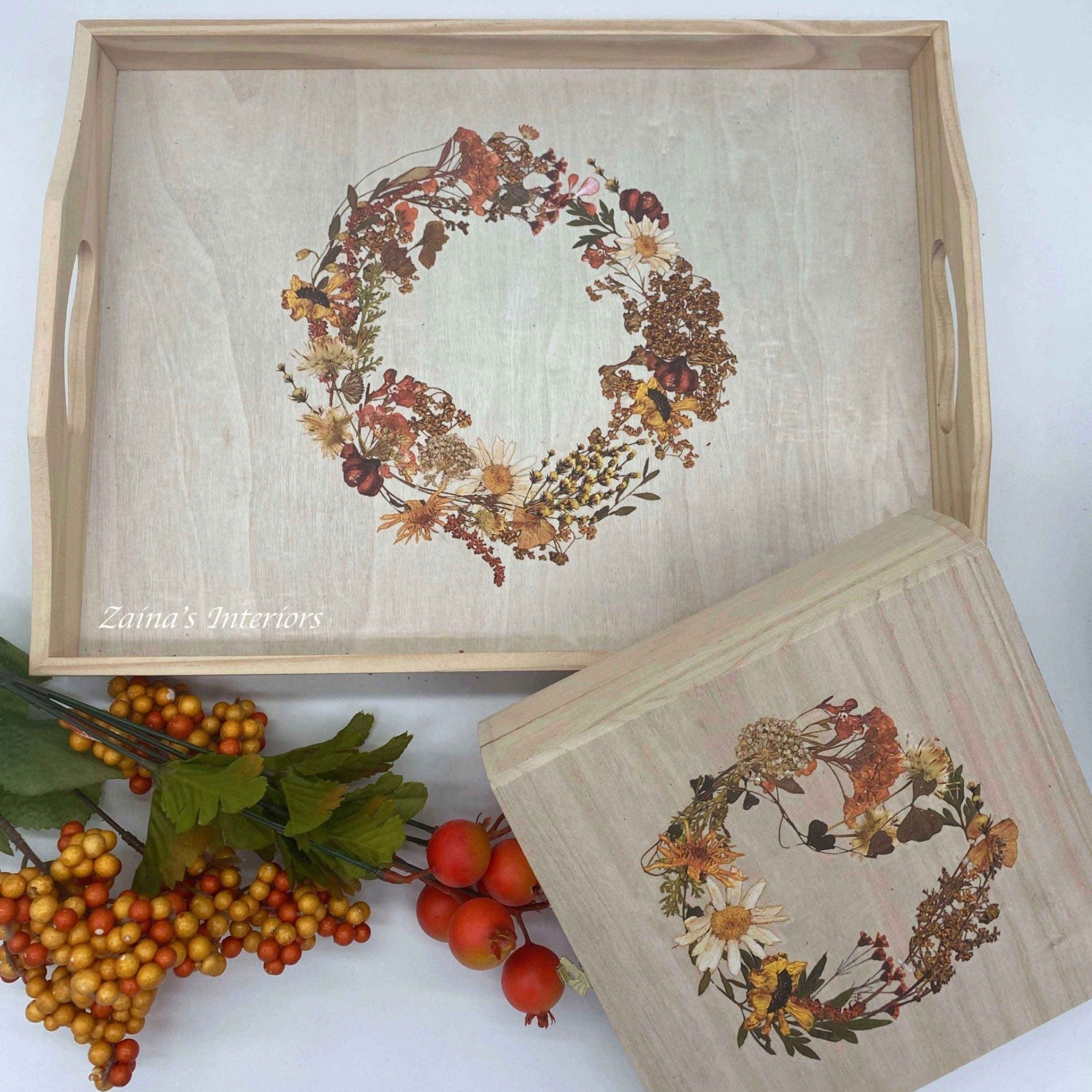 A natural wood serving tray and small box created by Zaina's Interiors both feature ReDesign with Prima's Dried Wildflowers small transfer on them.