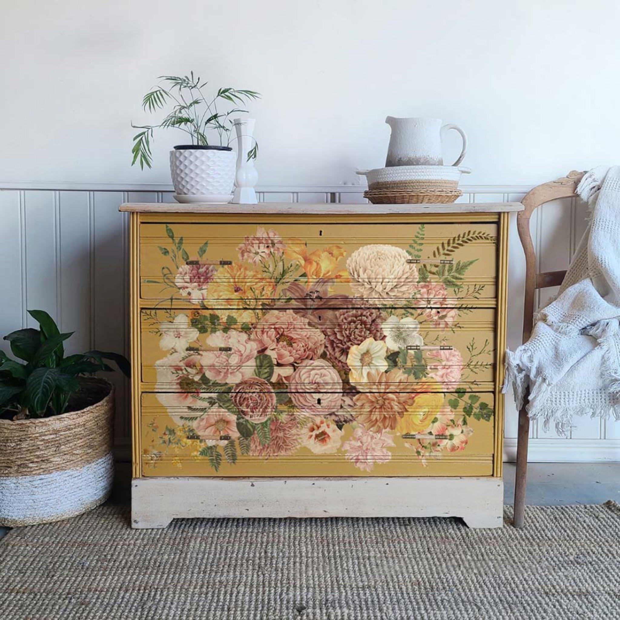 A vintage 3-drawer dresser is painted dark mustard yellow with cream and features ReDesign with Prima's Kacha Woodland Floral transfer covering the front of its drawers.