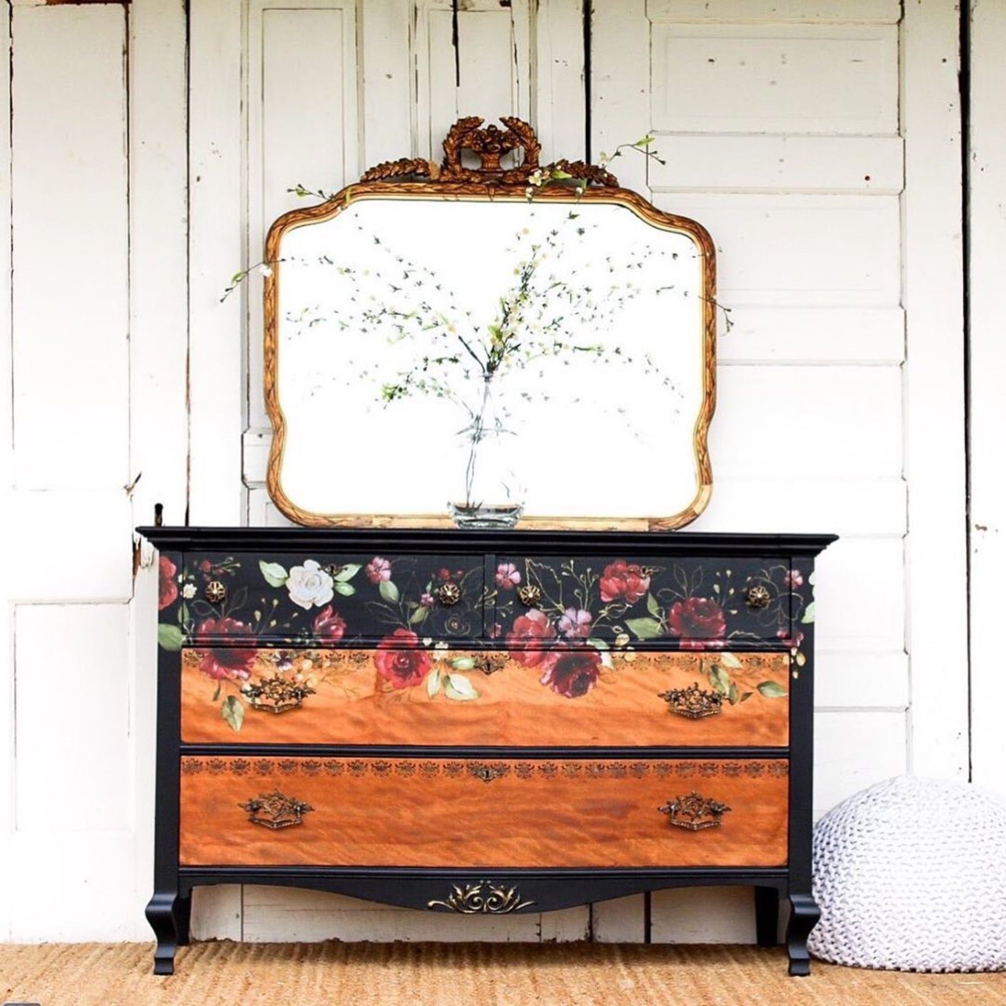 A vintage dresser is painted black with 2 large natural wood drawers and features ReDesign with Prima's Midnight Floral transfer on it. 