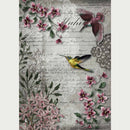 Rice paper featuring vibrant yellow and purple hummingbirds dancing around beautiful pink flowers on a vintage-inspired document. White borders are on the sides.