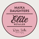 A white background with a pink circle with a brown outline and brown text reading: Maika Daughters. Elite Retailer. Dixie Belle Paint Company.