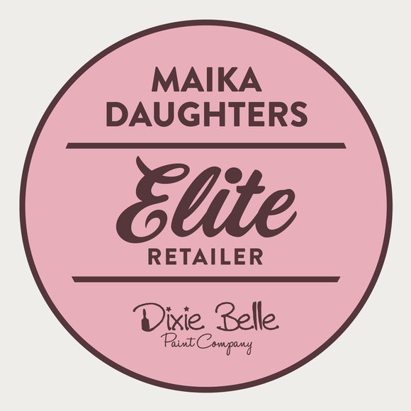 A white background with a pink circle with a brown outline and brown text reading: Maika Daughters. Elite Retailer. Dixie Belle Paint Company.