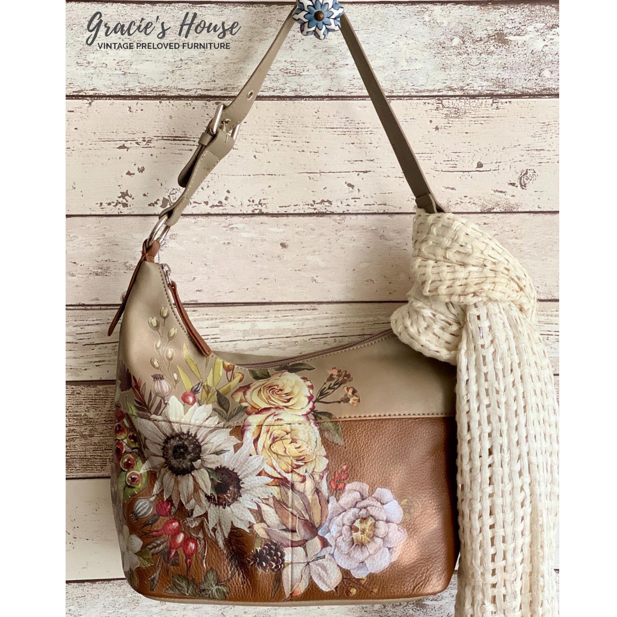 A brown leather purse refurbished by Gracie's House features ReDesign with Prima's Sunflower Farms transfer on it.