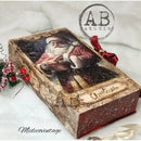 Decorative box with Santa Claus design and red ribbon, featuring 'AB Studio' and 'Midecovintage' branding.