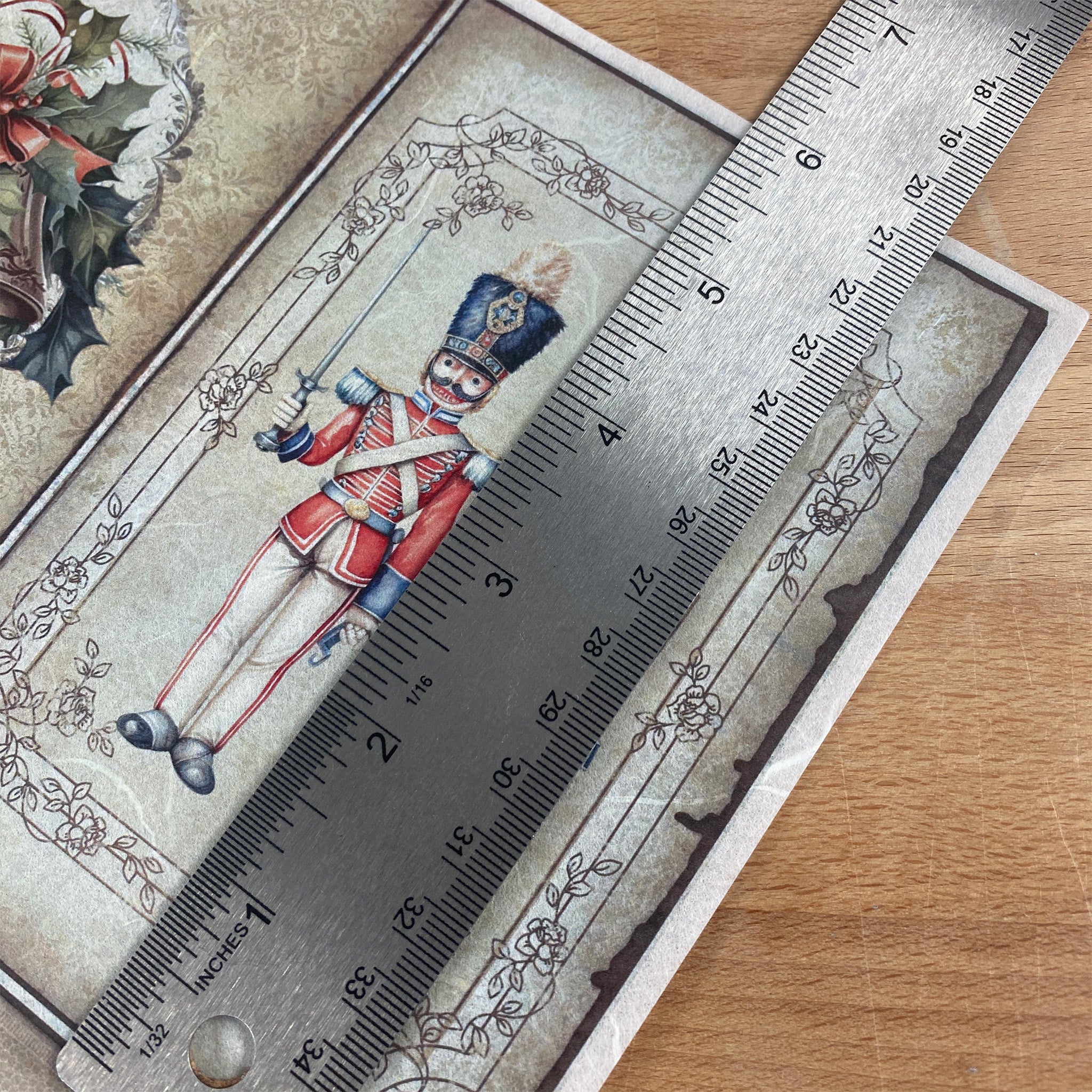 Ruler on a decorative paper with a soldier illustration on a wooden surface