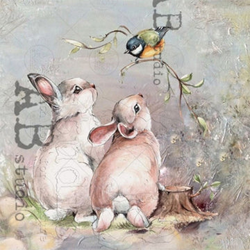 Close-up of an A4 rice paper featuring 2 adorable bunnies looking up at a small bird on a branch.