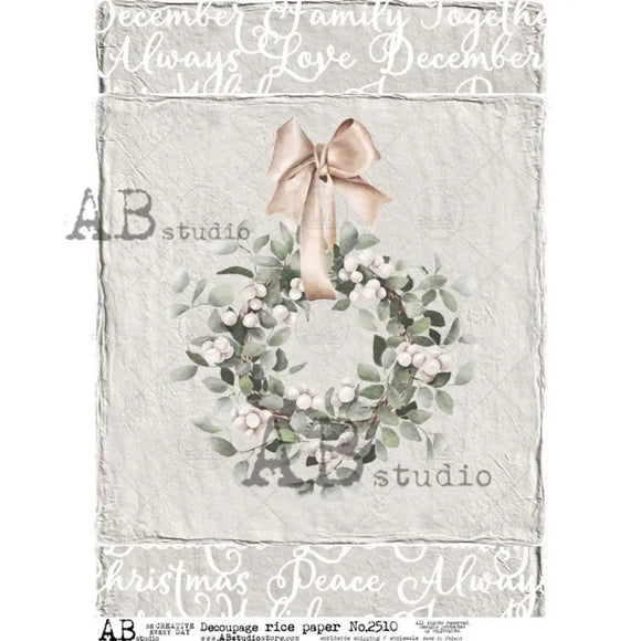 A4 rice paper design that features a country wreath against a distressed gray backdrop with Christmas words bordering the top and bottom is against a white background.
