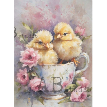 A4 rice paper design that features 2 cute yellow chicks nestled in a teacup, surrounded by sweet pink flowers and are against a white background. White borders are on the sides.