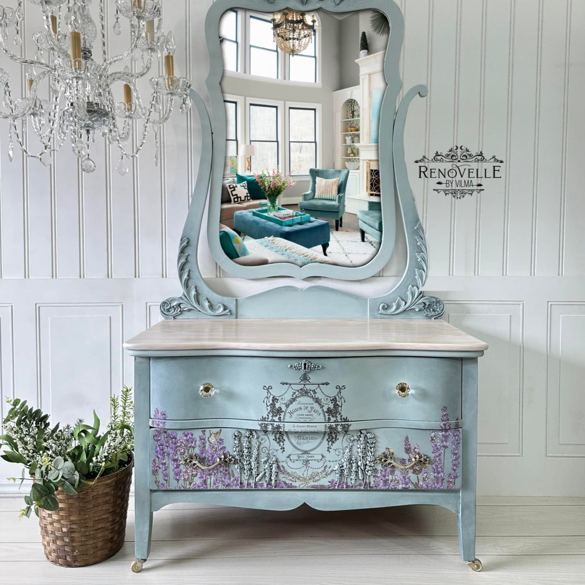 A vintage 2-drawer dresser with an attached mirror refurbished by Renovelle by Vilma is painted pale blue and features ReDesign with Prima's Champs de Lavende transfer on its bottom drawer.