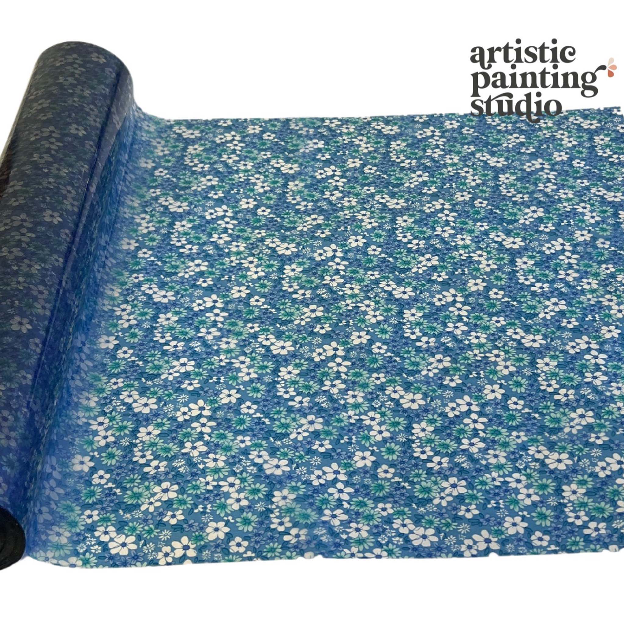 A roll of a transparent metallic foil transfer that features an array of small flowers with a transparent blue background is against a white background.