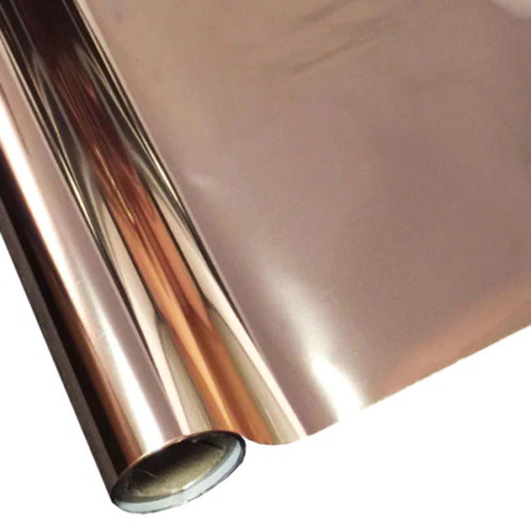A roll of a pink gold metallic foil transfer is against a white background.