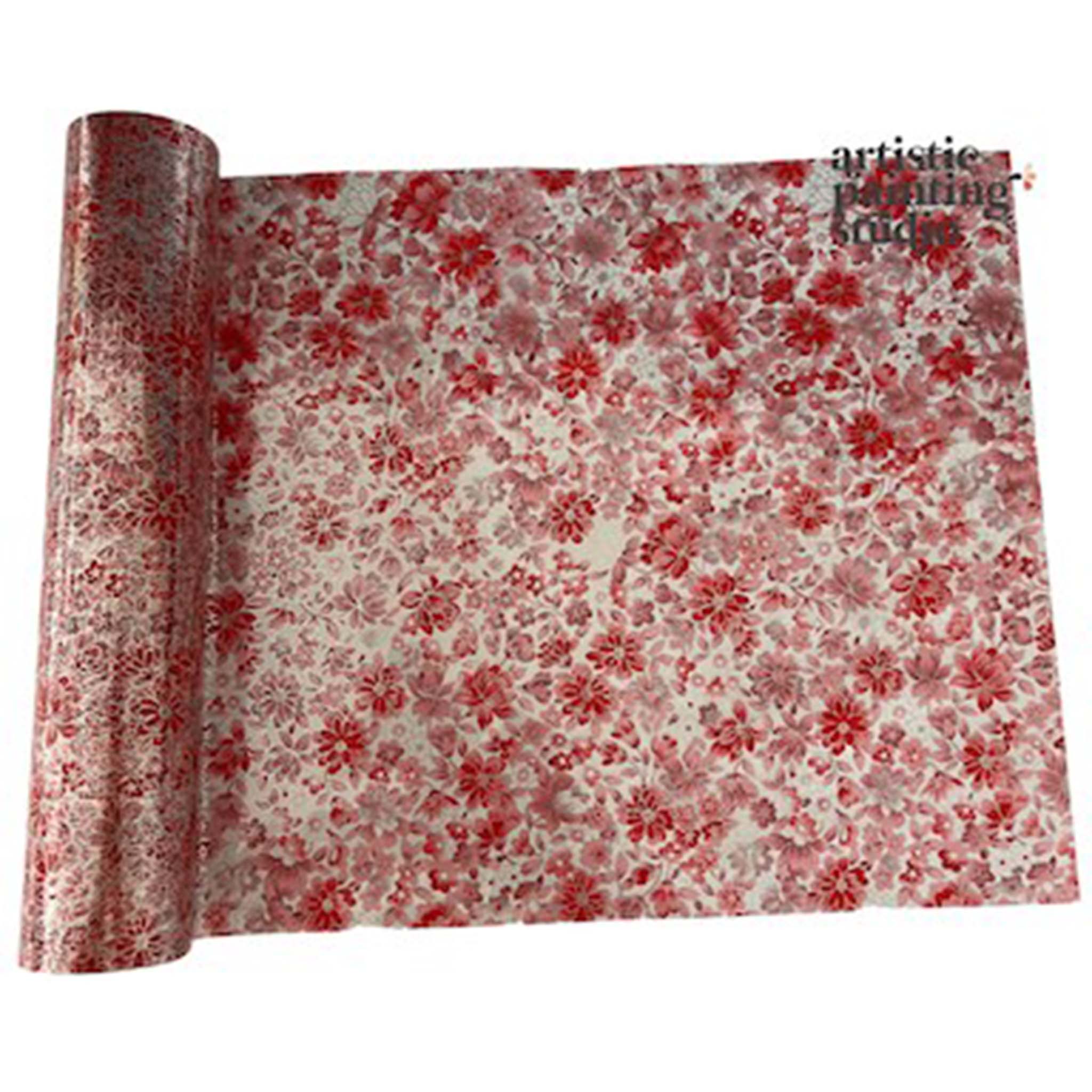 A roll of a transparent metallic transfer foil that features red and pink flower blooms is against a white background.