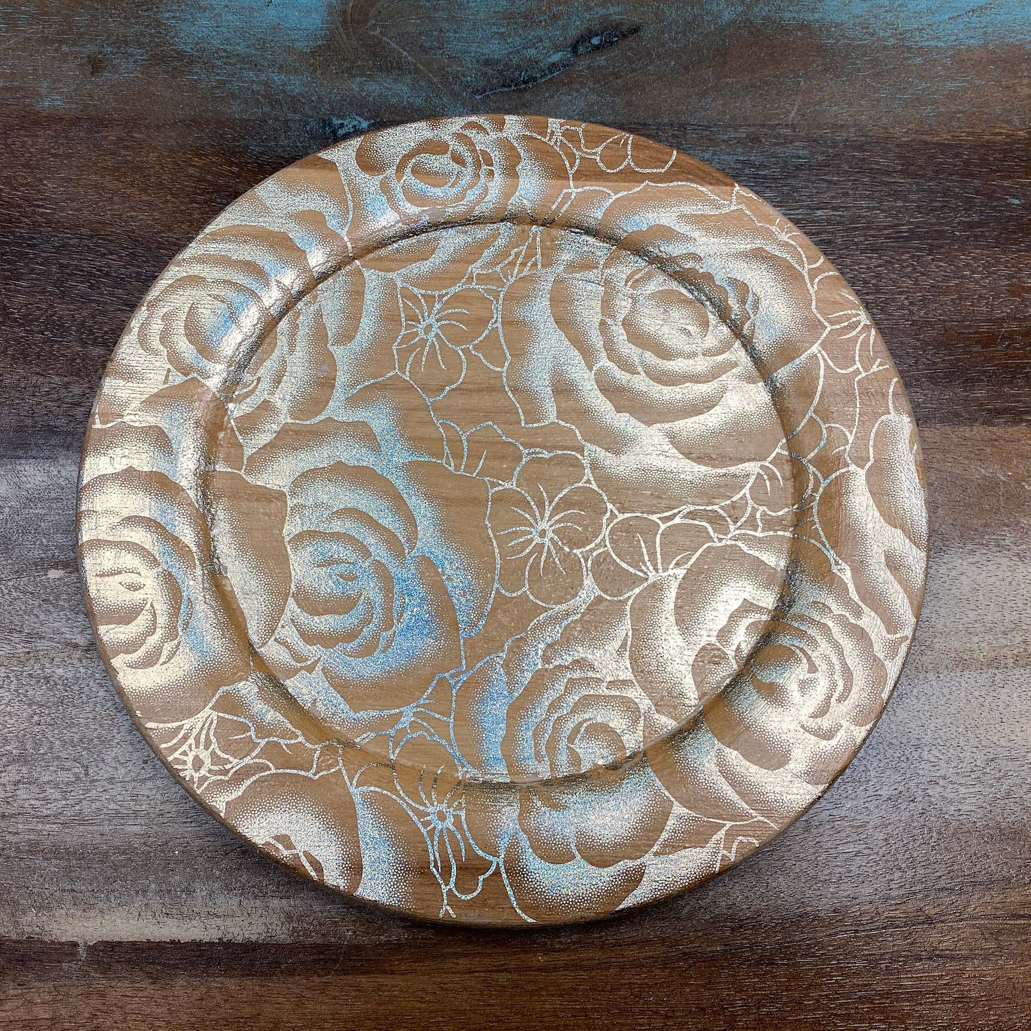 A wood round tray features Artistic Painting Studio's Portia Gold Metallic Transfer Foil on it.