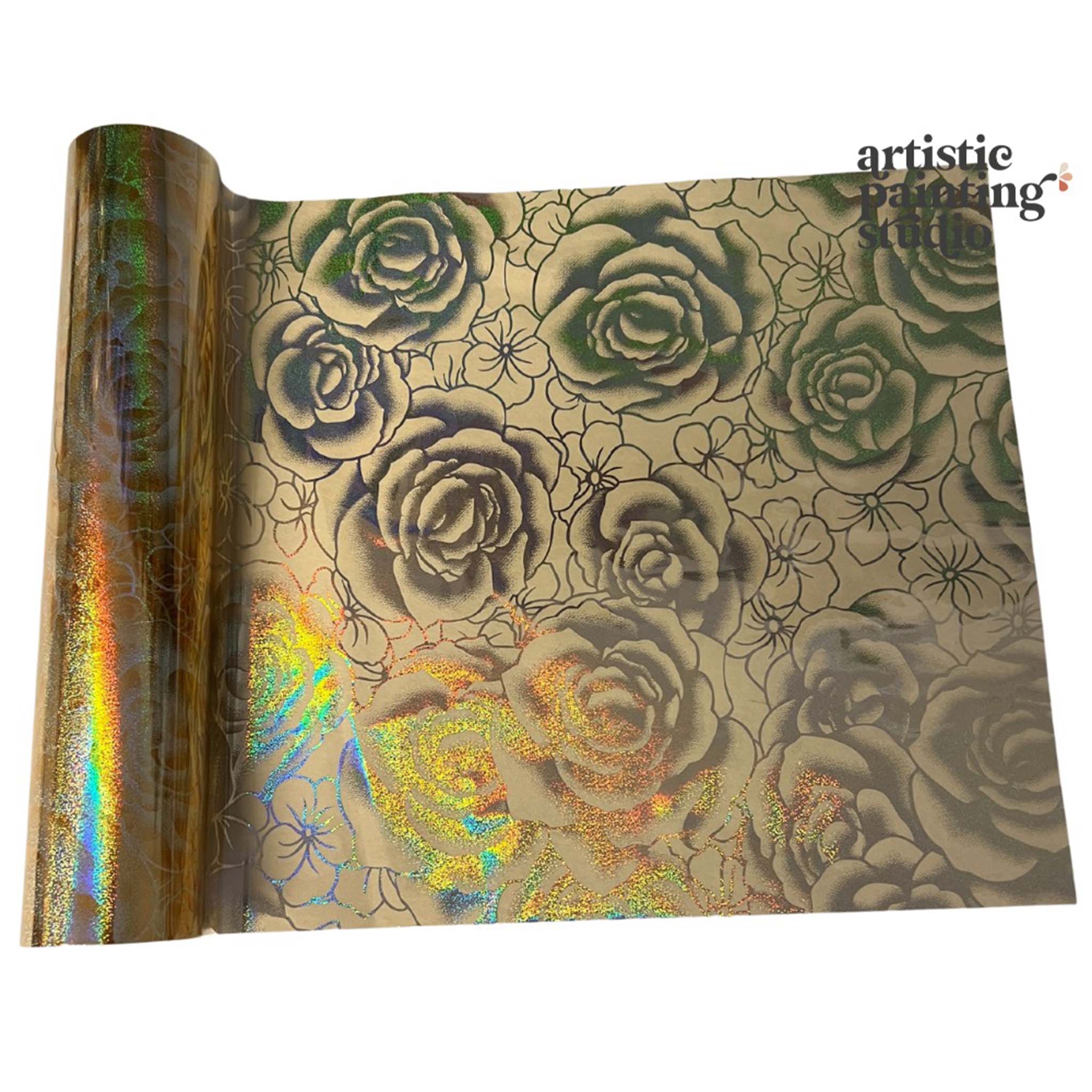 A roll of a holographic gold metallic transfer foil that features rose blooms is against a white background.