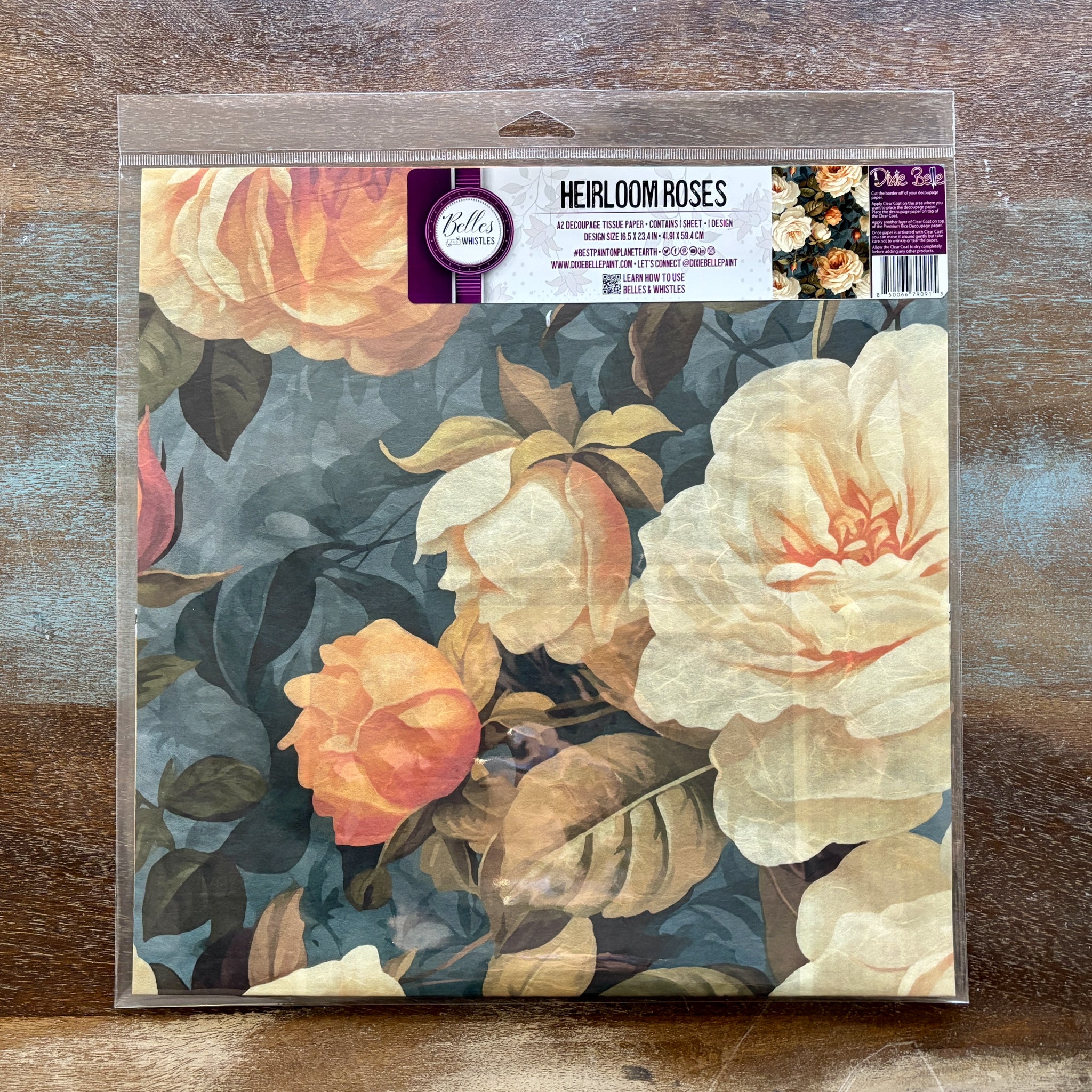 A package of Belles and Whistles' Heirloom Roses A2 rice paper is against a wood background.