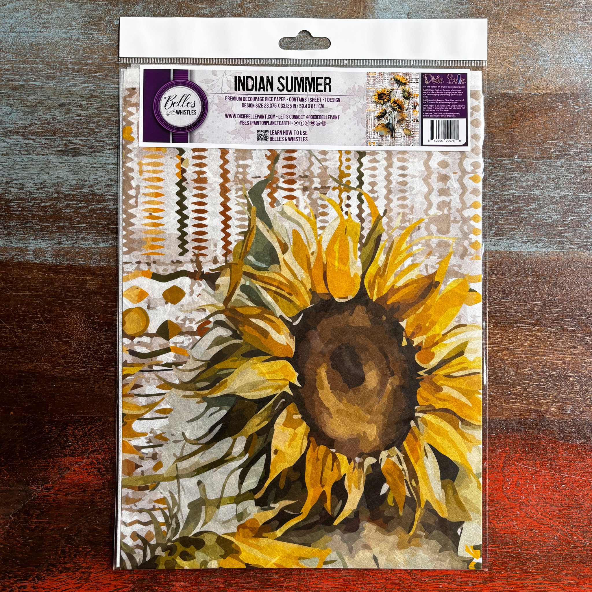 A package of Belles & Whistles' Indian Summer A1 rice paper is against a dark wood background.