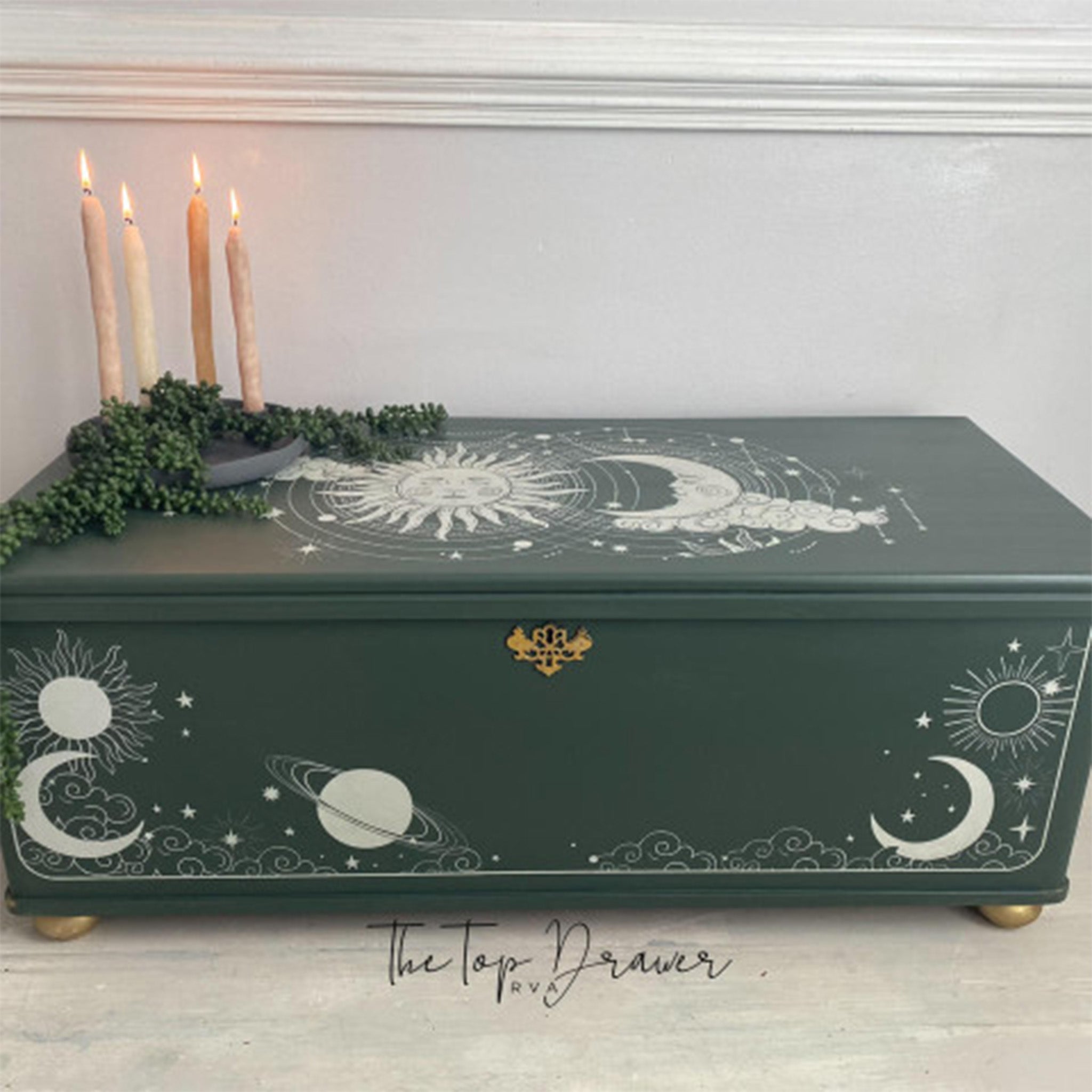 A small wood box refurbished by The Top Drawer is painted Hunter green and features Belles & Whistles' Lani's Celestial Dream rub-on transfer on it.