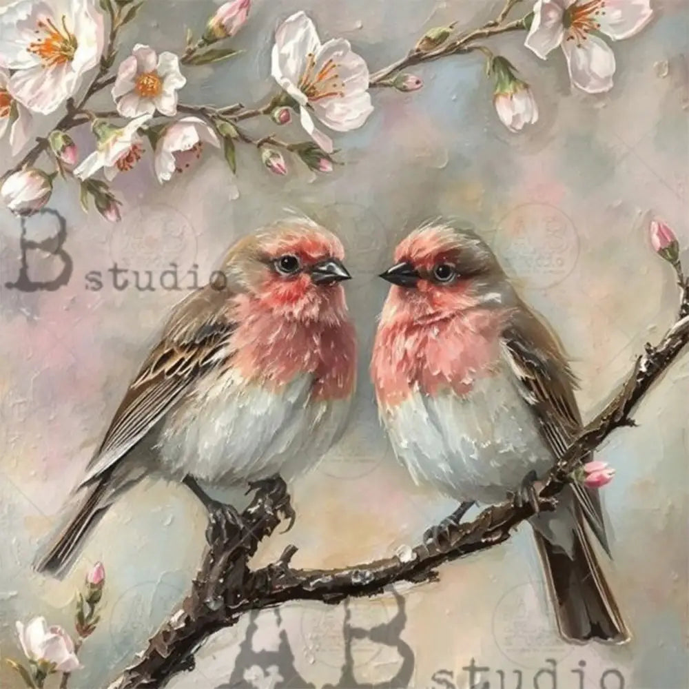 Close-up of a rice paper featuring two love birds perched in a cherry blossom tree against a soft moody backdrop.