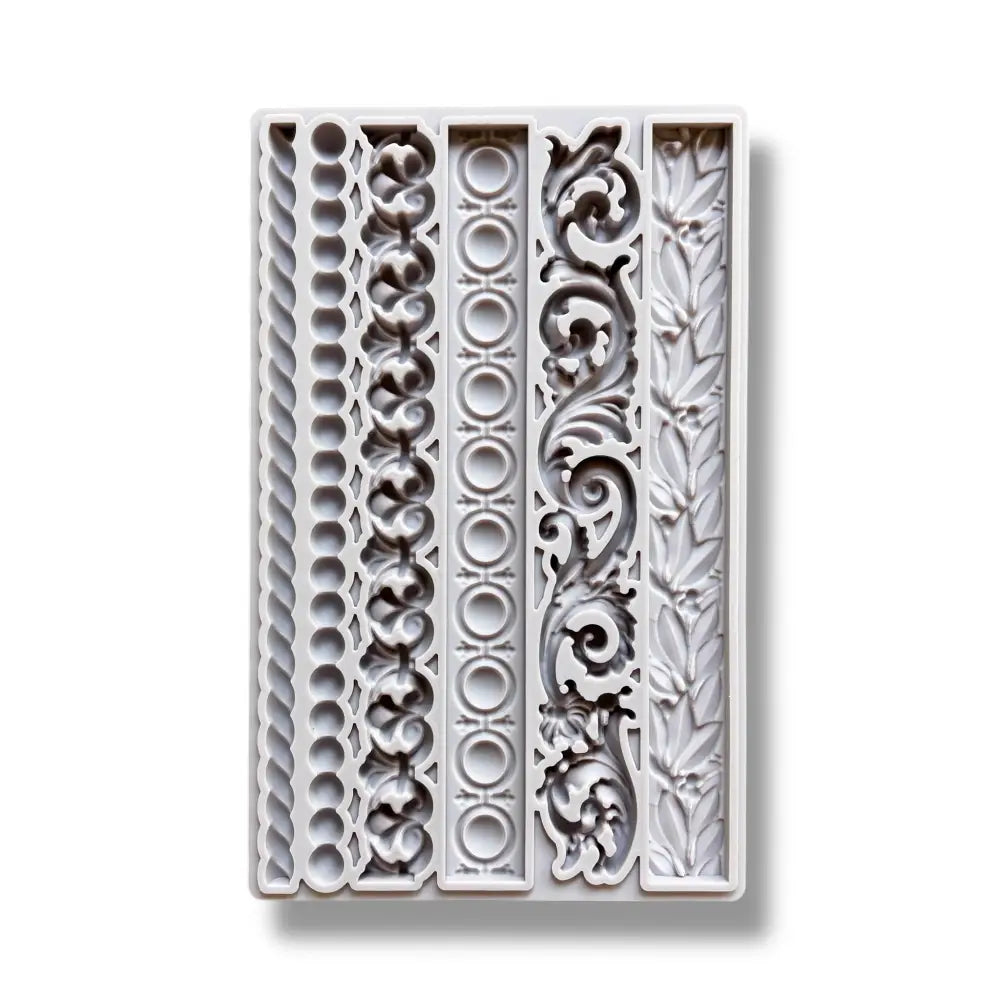 A light grey silicone mold featuring 6 intricate border designs are against a white background.