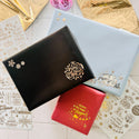 Three paper wrapped presents feature Get Inspired's Christmas Greetings Gold Foil small transfer on them.