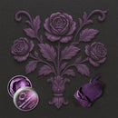 An open container of Dadarkar Art's Amethyst Mauve Metallic Wax Mousse is shown on a silicone mold casting of a bouquet of 3 roses. A color swatch sample is also shown.