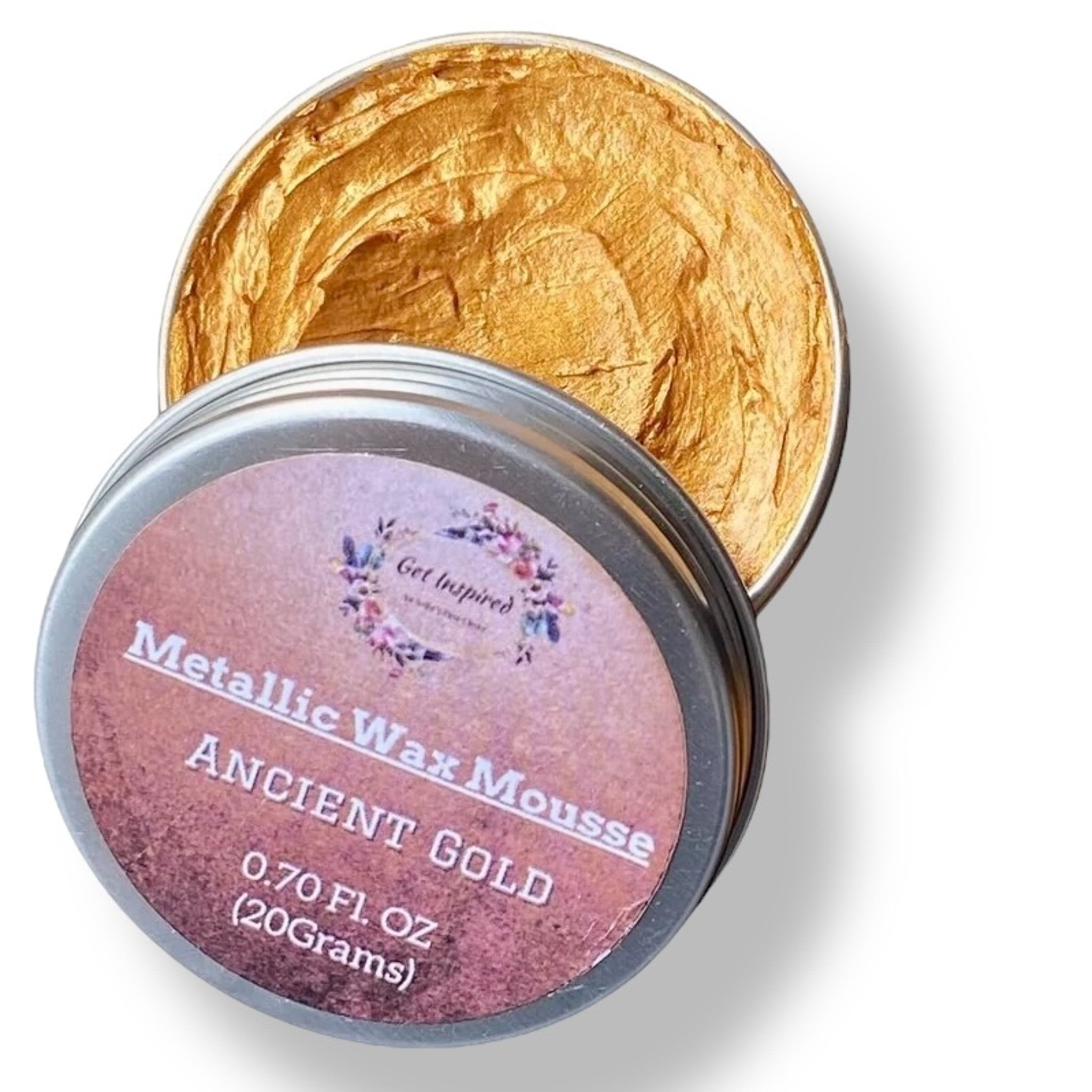 A 0.70 (20 ml) open container of a rich gold color metallic wax mousse paste is against a white background.