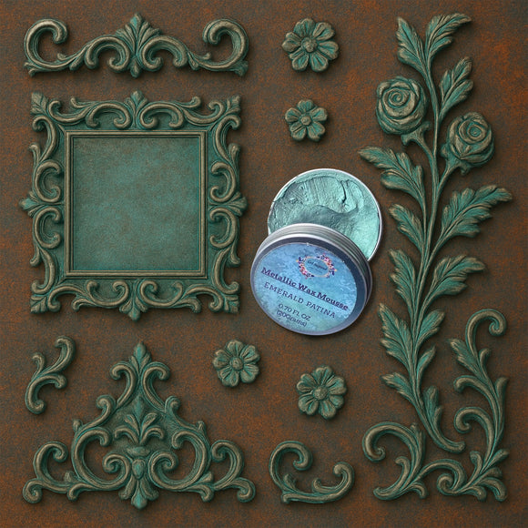 An open container of Dadarkar Art's Emerald Patina Metallic Wax Mousse is amongst resin silicone mold castings of a vintage square frame and various corner and accent rose flourishes.