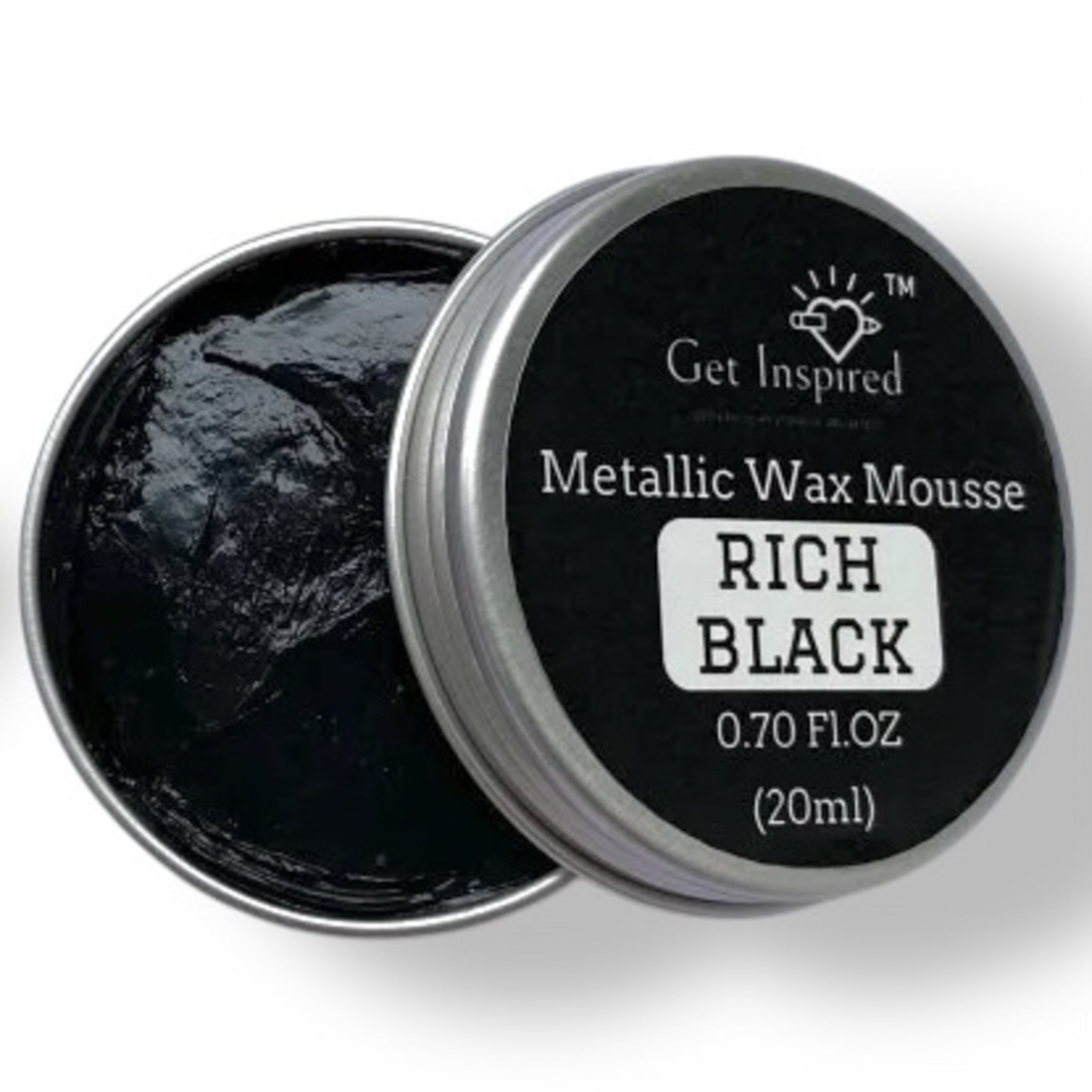 A 0.70 (20 ml) open container of a black metallic wax mousse paste is against a white background.