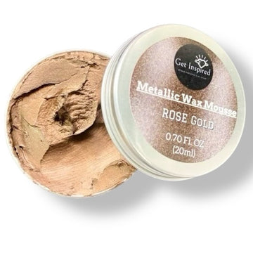 A 0.70 (20 ml) open container of a rose gold color metallic wax mousse paste is against a white background.