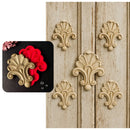 Decorative wall appliqués on a wooden panel with close-up inset showing the silicone mold.