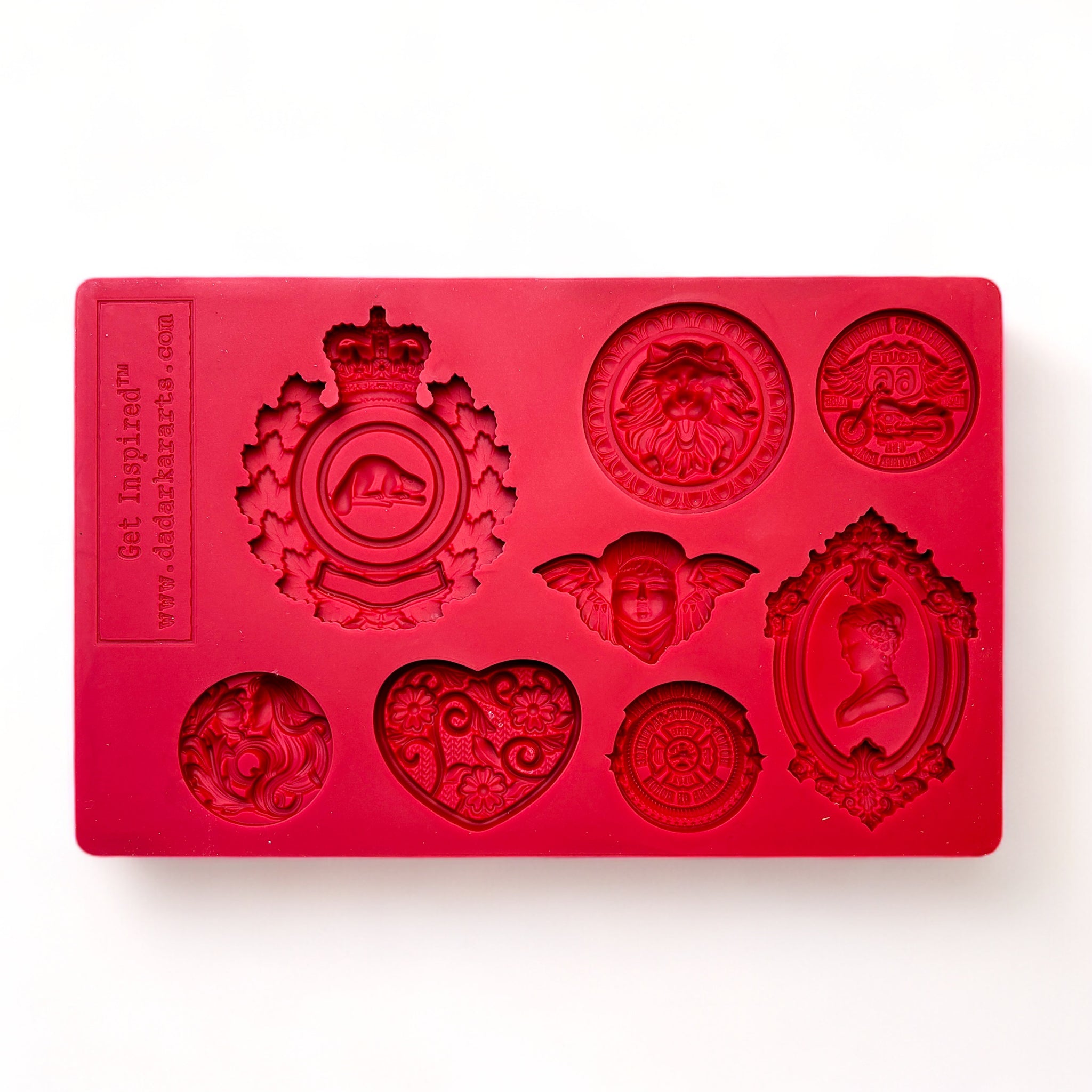 A red silicone mold of 8 ornate regal medallions is against a white background.