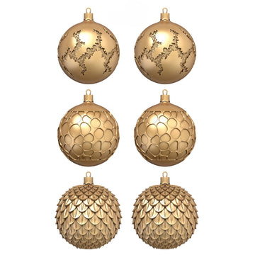 Six gold colored ornate half ornaments created from a silicone mold are against a white background.