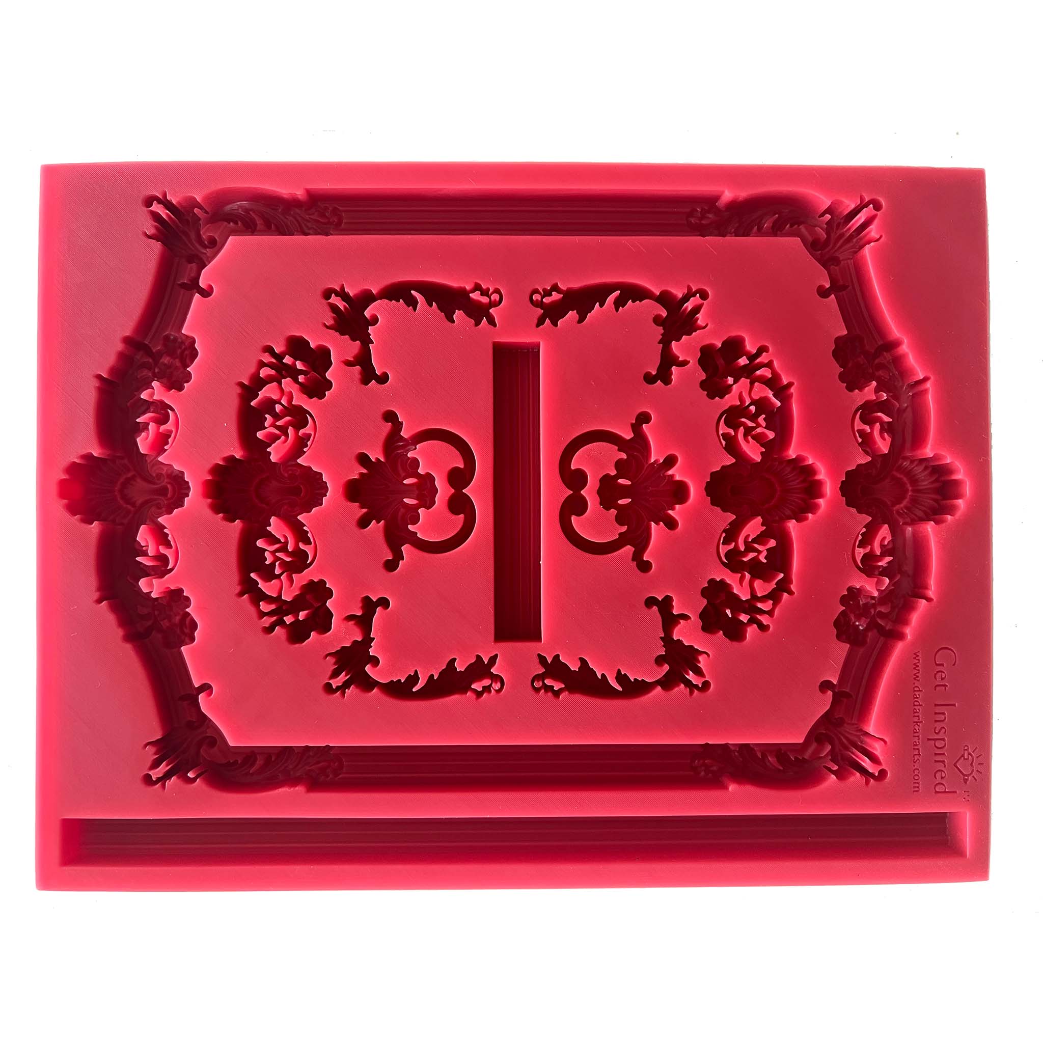 A red silicone mold laying horizontally features ornate vintage frames and borders is against a white background.