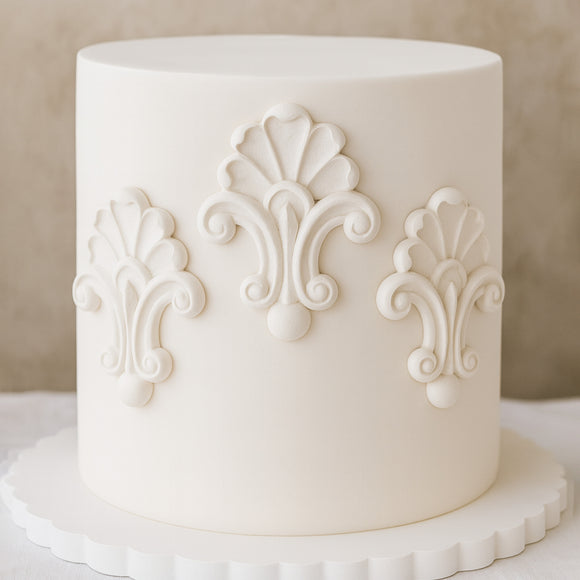 White cake with decorative patterns on a neutral background