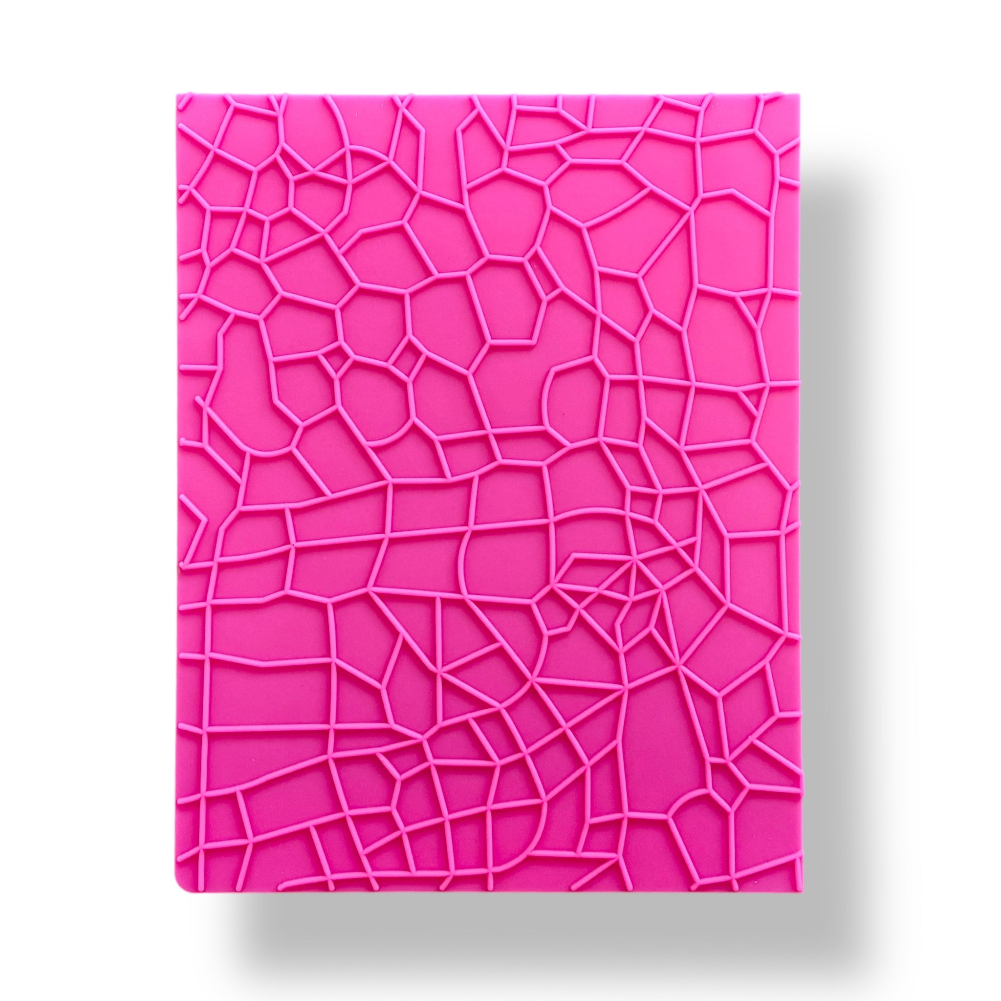 A pink silicone texture sheet featuring a realistic stone pattern is against a white background.