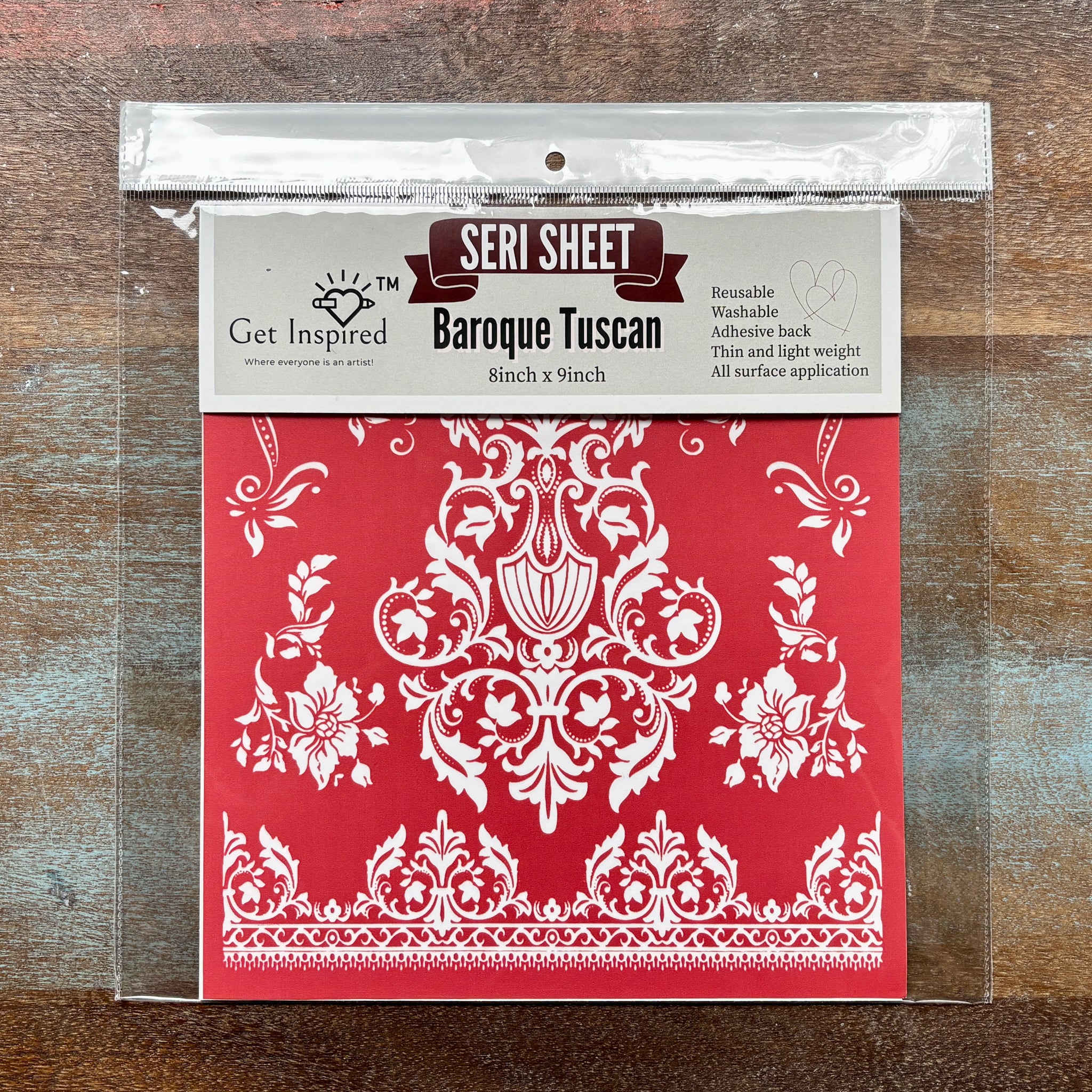 A package of Dadarkar Art by Get Inspired's Baroque Tuscan Silkscreen Stencil is against a wood background.