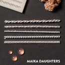 Silver colored castings of 5 mini rope borders are against a dark grey background.