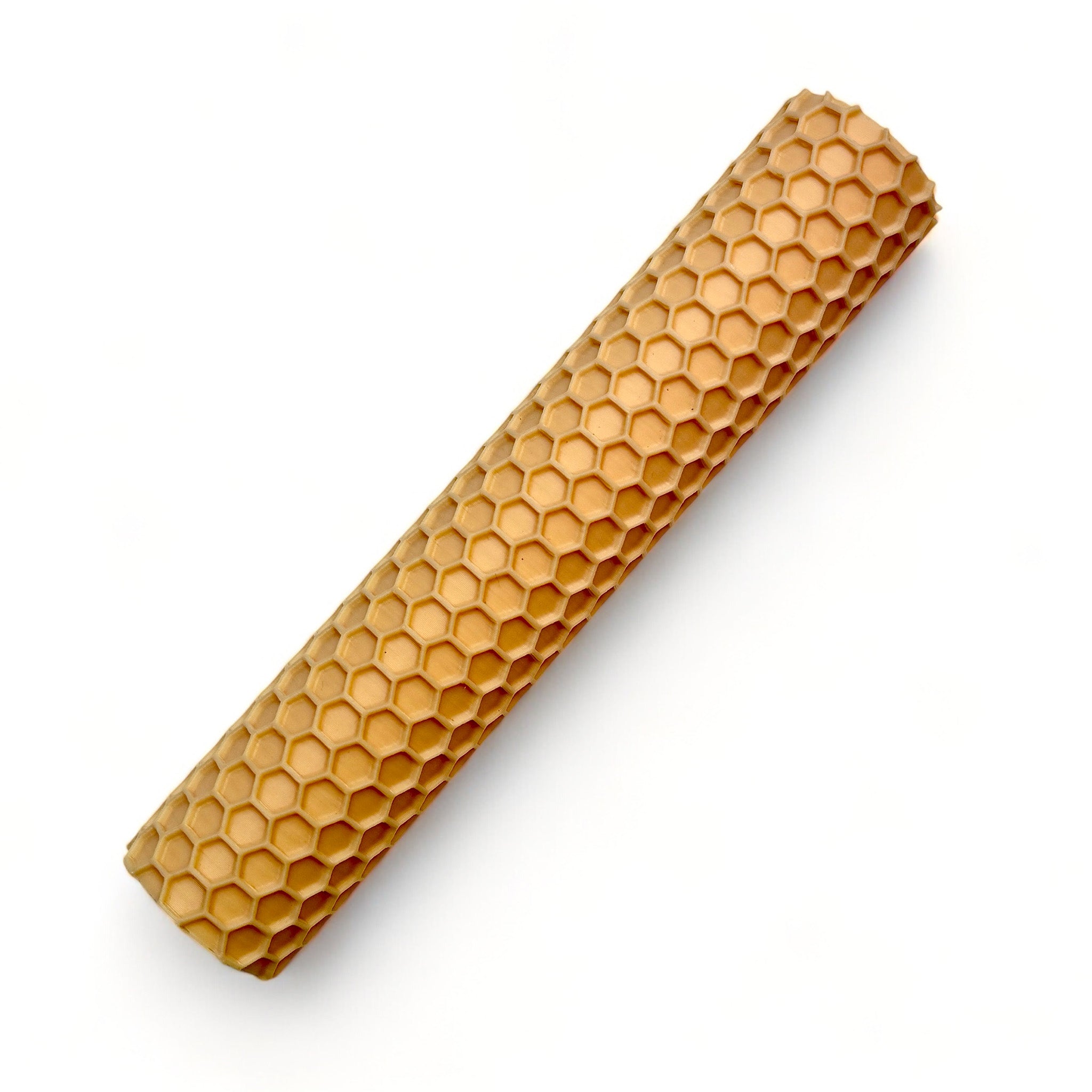 A seamless texture roller featuring a honeycomb pattern is against a white background.
