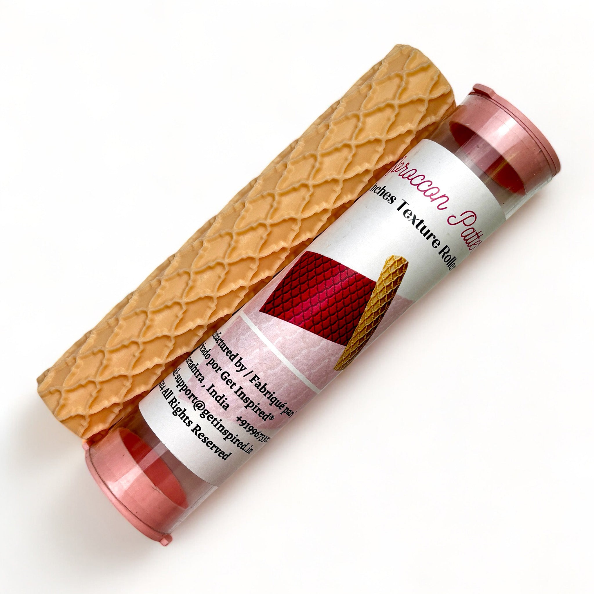 A texture roller and packaging tube of Dadarkar Art's Moroccan Pattern are against a white background.
