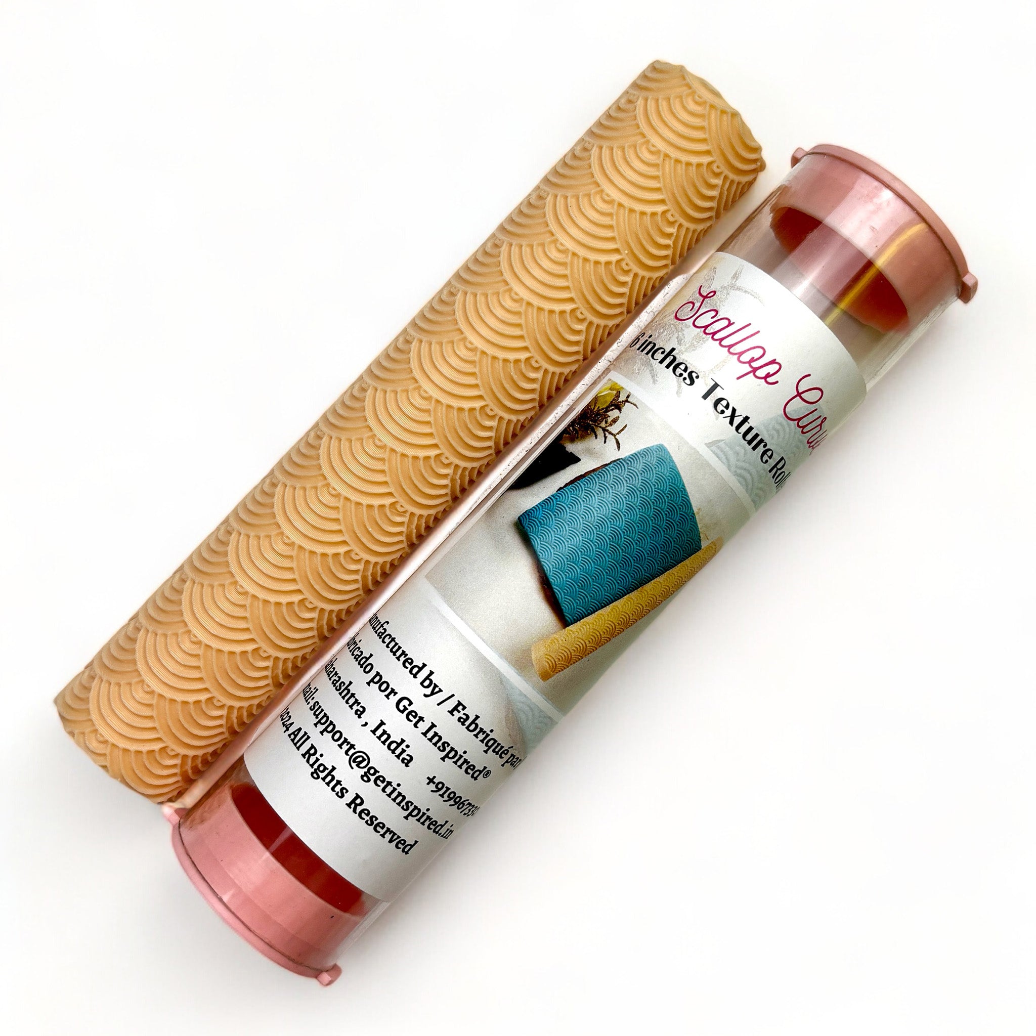 A texture roller and packaging tube of Dadarkar Art's Scallop Curve are against a white background.
