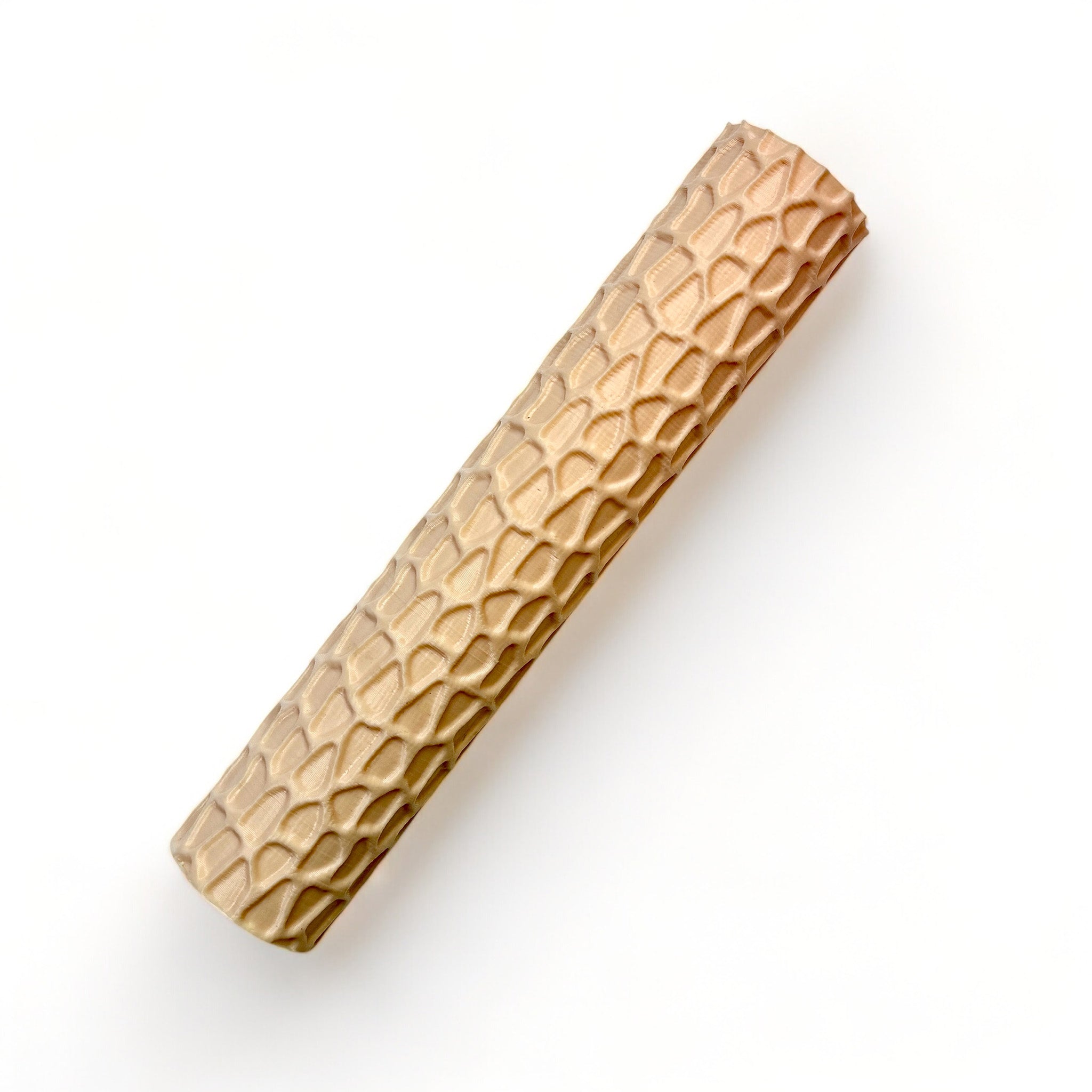 A seamless texture roller featuring a stone pattern is against a white background.
