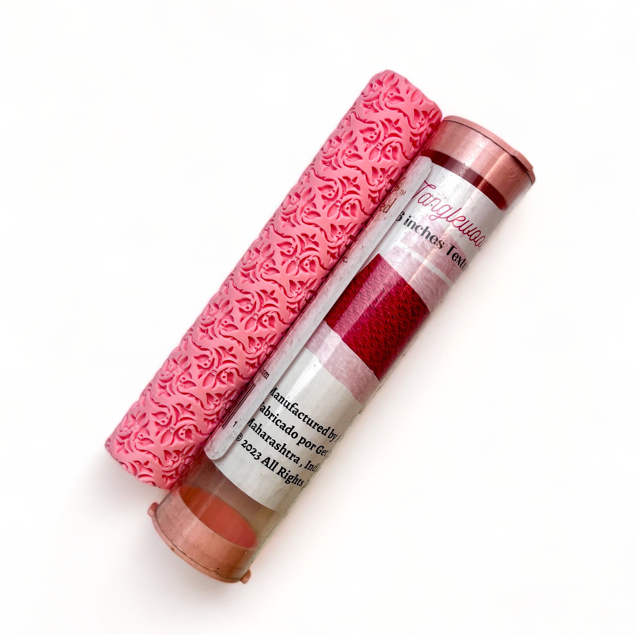 A texture roller and packaging tube of Dadarkar Art's Tanglewood Damask are against a white background.
