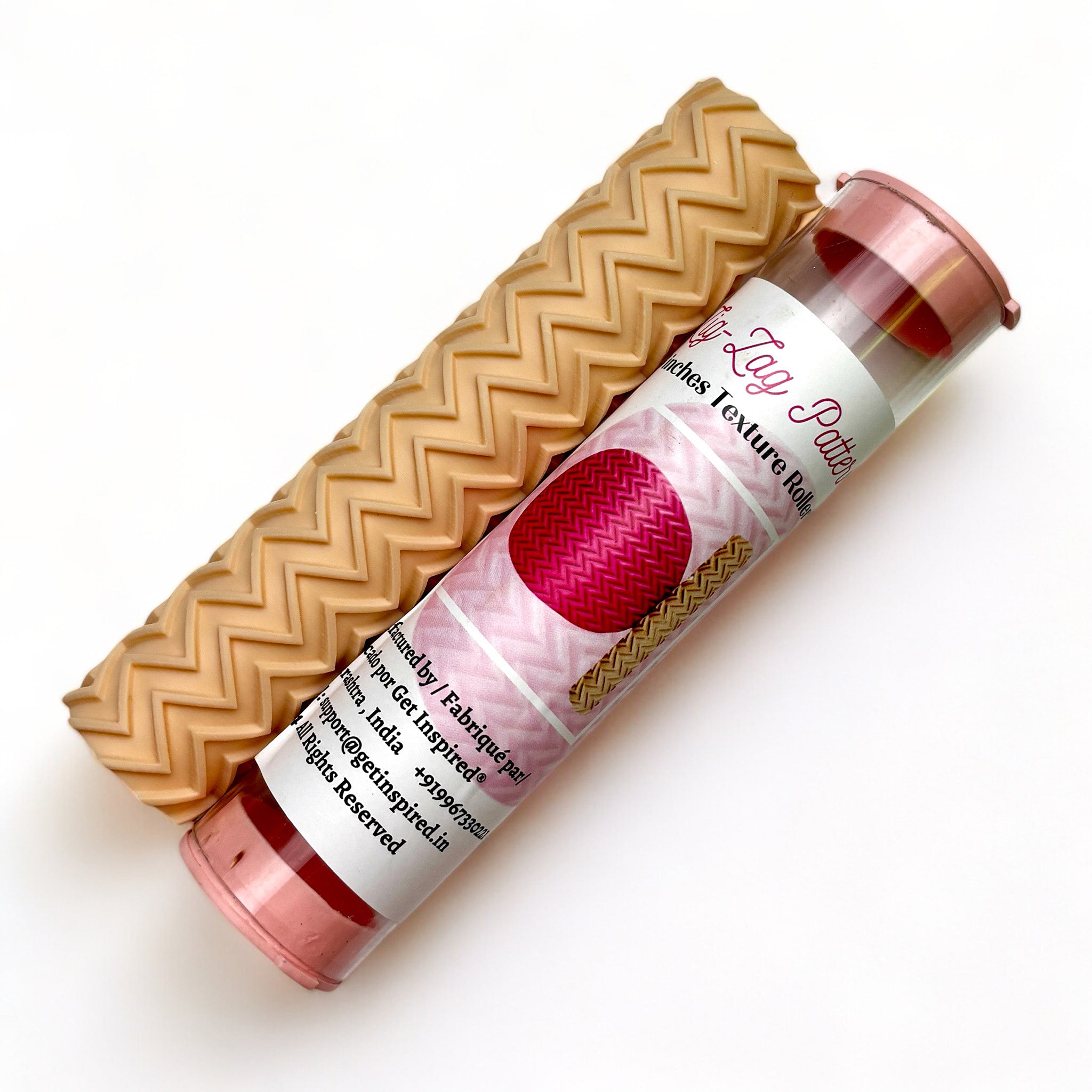 A texture roller and packaging tube of Dadarkar Art's Zig Zag Pattern are against a white background.
